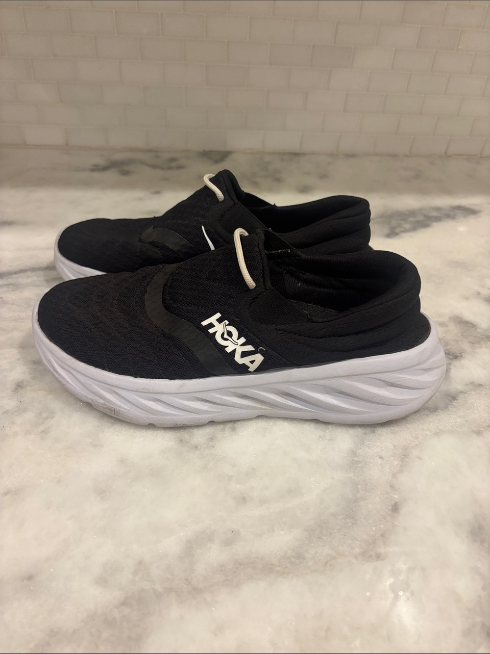 Hoka Women’s Black and White Slip-On Sneakers